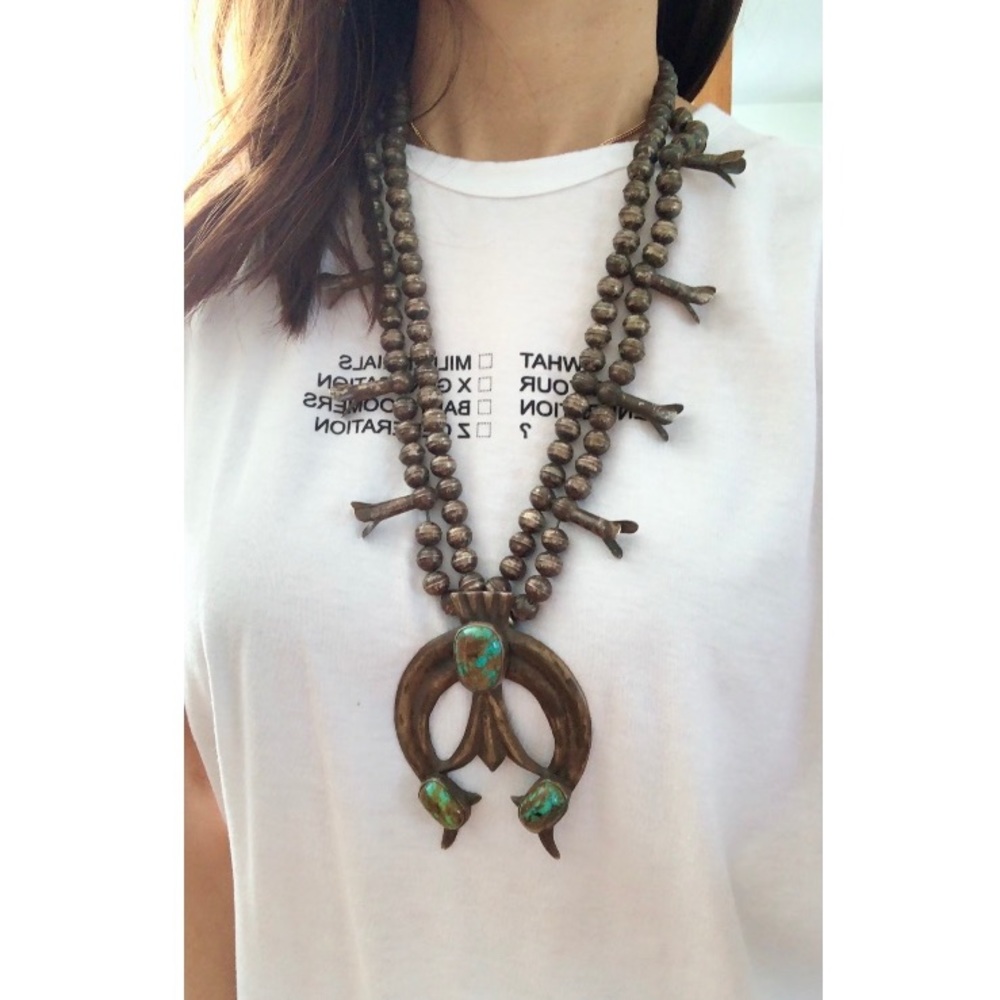 Heavy vintage silver squash blossom necklace with a large naja